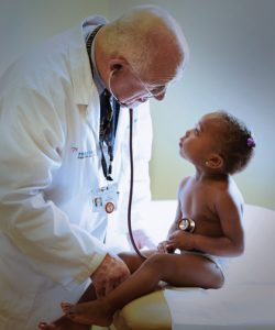 Dr. John Moran  with small kid